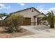 Charming single story house featuring a desert landscaped front yard and a two-car garage at 46185 W Dutchman Dr, Maricopa, AZ 85139