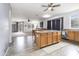 Open kitchen and dining area with tile flooring and stainless steel appliances, perfect for cooking and gathering at 46185 W Dutchman Dr, Maricopa, AZ 85139