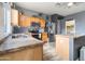Modern kitchen with stainless appliances, granite countertops, and ample cabinet space at 46185 W Dutchman Dr, Maricopa, AZ 85139