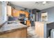 Modern kitchen with stainless appliances, granite countertops, and ample cabinet space at 46185 W Dutchman Dr, Maricopa, AZ 85139