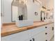 Stylish bathroom featuring a double vanity, modern sinks, and vintage-style lighting at 4640 W Gail Dr, Chandler, AZ 85226