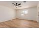 Spacious bedroom features wood-look floors, neutral paint, and a ceiling fan at 4640 W Gail Dr, Chandler, AZ 85226