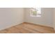 An interior bedroom view with hard wood floor and a view of the outside at 4640 W Gail Dr, Chandler, AZ 85226