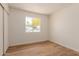 An interior bedroom view with hard wood floor and a view of the outside at 4640 W Gail Dr, Chandler, AZ 85226