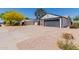 View of exterior elevation of home showcasing an attached garage and desert landscaping at 4640 W Gail Dr, Chandler, AZ 85226