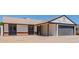Exterior elevation of home showcasing attached two-car garage and desert landscaping at 4640 W Gail Dr, Chandler, AZ 85226