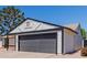 Close-up of exterior elevation showcasing an attached two-car garage and manicured landscaping at 4640 W Gail Dr, Chandler, AZ 85226