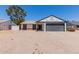 Charming single-story home showcasing a well-maintained facade, desert landscaping and an attached two car garage at 4640 W Gail Dr, Chandler, AZ 85226