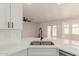 Updated kitchen features stainless steel appliances, an island and stainless steel sink at 4640 W Gail Dr, Chandler, AZ 85226