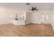 Open-concept living room showcases newly installed laminate flooring, updated lighting, and fresh neutral paint at 4640 W Gail Dr, Chandler, AZ 85226