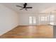 Spacious open concept living room featuring new flooring, neutral paint and modern lighting at 4640 W Gail Dr, Chandler, AZ 85226