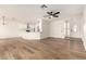 Bright open-concept living room with hardwood floors and views of the modern kitchen at 4640 W Gail Dr, Chandler, AZ 85226