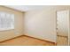 Bright bedroom featuring shuttered windows, neutral walls, and a door leading to a closet at 4711 S Los Feliz Dr, Tempe, AZ 85282