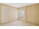 Neutral bedroom with carpet, shuttered windows and closet doors at 4711 S Los Feliz Dr, Tempe, AZ 85282