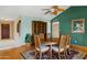 Elegant dining room with a wooden table, six chairs, and stylish decor at 4711 S Los Feliz Dr, Tempe, AZ 85282