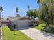Charming single-story home with a well-manicured lawn, mature trees, and an American flag waving proudly at 4711 S Los Feliz Dr, Tempe, AZ 85282