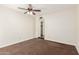 Spacious bedroom with a ceiling fan and closet for storage at 5208 S Deborah Dr, Tempe, AZ 85283