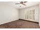 Bright, spacious bedroom with ceiling fan and shuttered windows for natural light at 5208 S Deborah Dr, Tempe, AZ 85283
