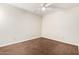 Clean bedroom featuring a ceiling fan, electrical outlets and brown carpet at 5208 S Deborah Dr, Tempe, AZ 85283