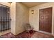 Inviting front porch featuring a classic bench and a secure, stylish front door at 5208 S Deborah Dr, Tempe, AZ 85283