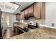 Well-equipped kitchen featuring granite countertops and stainless steel appliances at 5208 S Deborah Dr, Tempe, AZ 85283