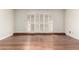 Bright, open living room featuring hardwood floors and plantation shutters for natural light at 5208 S Deborah Dr, Tempe, AZ 85283