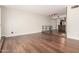 Spacious living room with wood floors and a view into the kitchen area at 5208 S Deborah Dr, Tempe, AZ 85283