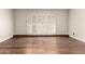 Bright living room featuring attractive wood floors and shuttered doors at 5208 S Deborah Dr, Tempe, AZ 85283