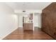 Open-concept living area with a kitchen featuring granite countertops and stylish wood accent wall at 5208 S Deborah Dr, Tempe, AZ 85283
