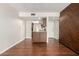 Open-concept living room with wood floors and a view into the kitchen area at 5208 S Deborah Dr, Tempe, AZ 85283