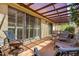 Inviting covered patio with tile flooring and comfortable seating, perfect for outdoor relaxation and entertaining at 5208 S Deborah Dr, Tempe, AZ 85283