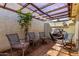 Relaxing patio with four chairs, a barbecue and a transparent pergola at 5208 S Deborah Dr, Tempe, AZ 85283