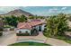 Stunning aerial view of the home showcases its well-manicured front yard and mountain backdrop at 5602 W Alameda Rd, Glendale, AZ 85310