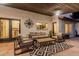 Comfortable outdoor seating with a geometric rug adorns the covered back patio at 5602 W Alameda Rd, Glendale, AZ 85310