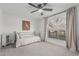 Serene bedroom with neutral color palette, large window, and soft carpet at 5602 W Alameda Rd, Glendale, AZ 85310