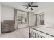 Cozy bedroom with a dresser, mirrored closet doors, and comfortable bedding at 5602 W Alameda Rd, Glendale, AZ 85310