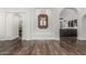 Elegant entryway features dark wood floors, arched doorways, and a decorative mirror at 5602 W Alameda Rd, Glendale, AZ 85310