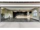 Spacious garage with epoxy floors, built in storage, and natural light at 5602 W Alameda Rd, Glendale, AZ 85310