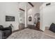 Spacious and well-lit living room features hardwood floors, wood beams, and a designer rug at 5602 W Alameda Rd, Glendale, AZ 85310