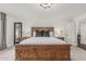 Large main bedroom with decorative wood bed frame and access to outdoor patio at 5602 W Alameda Rd, Glendale, AZ 85310