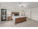 Spacious main bedroom with carpet, wood bed frame, and access to the outdoor patio at 5602 W Alameda Rd, Glendale, AZ 85310