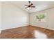 Spacious bedroom featuring hardwood floors, vaulted ceilings, and a window for natural light at 5852 E Enrose St, Mesa, AZ 85205