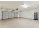 Spacious two-car garage with ample storage and epoxy flooring at 5852 E Enrose St, Mesa, AZ 85205