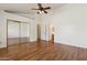 Large main bedroom featuring hardwood floors, vaulted ceilings, closet, and bathroom access at 5852 E Enrose St, Mesa, AZ 85205