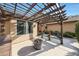 Relaxing backyard patio featuring a pergola, seating, fire pit, and scenic views at 6101 W Grandview Rd, Glendale, AZ 85306