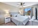 Bright bedroom with a queen-sized bed, lots of natural light, and backyard views at 6101 W Grandview Rd, Glendale, AZ 85306