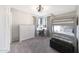 Cozy bedroom featuring a bunk bed, corner windows, and neutral decor at 6101 W Grandview Rd, Glendale, AZ 85306