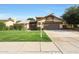 Landscaped front yard, covered entry, and a well-maintained exterior at 6101 W Grandview Rd, Glendale, AZ 85306