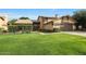 Charming two-story home with well-manicured lawn, mature trees, and a welcoming covered entryway at 6101 W Grandview Rd, Glendale, AZ 85306