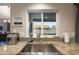 Kitchen sink overlooking backyard, stainless steel hardware, and granite countertops at 6101 W Grandview Rd, Glendale, AZ 85306